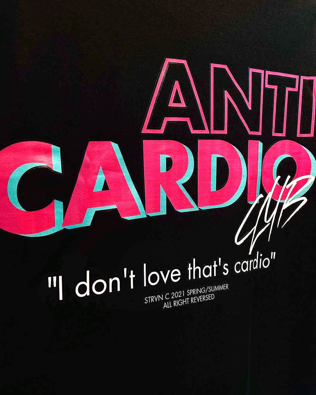 Anti Cardio back graphic typography print detail on black shirt, enhanced photograph