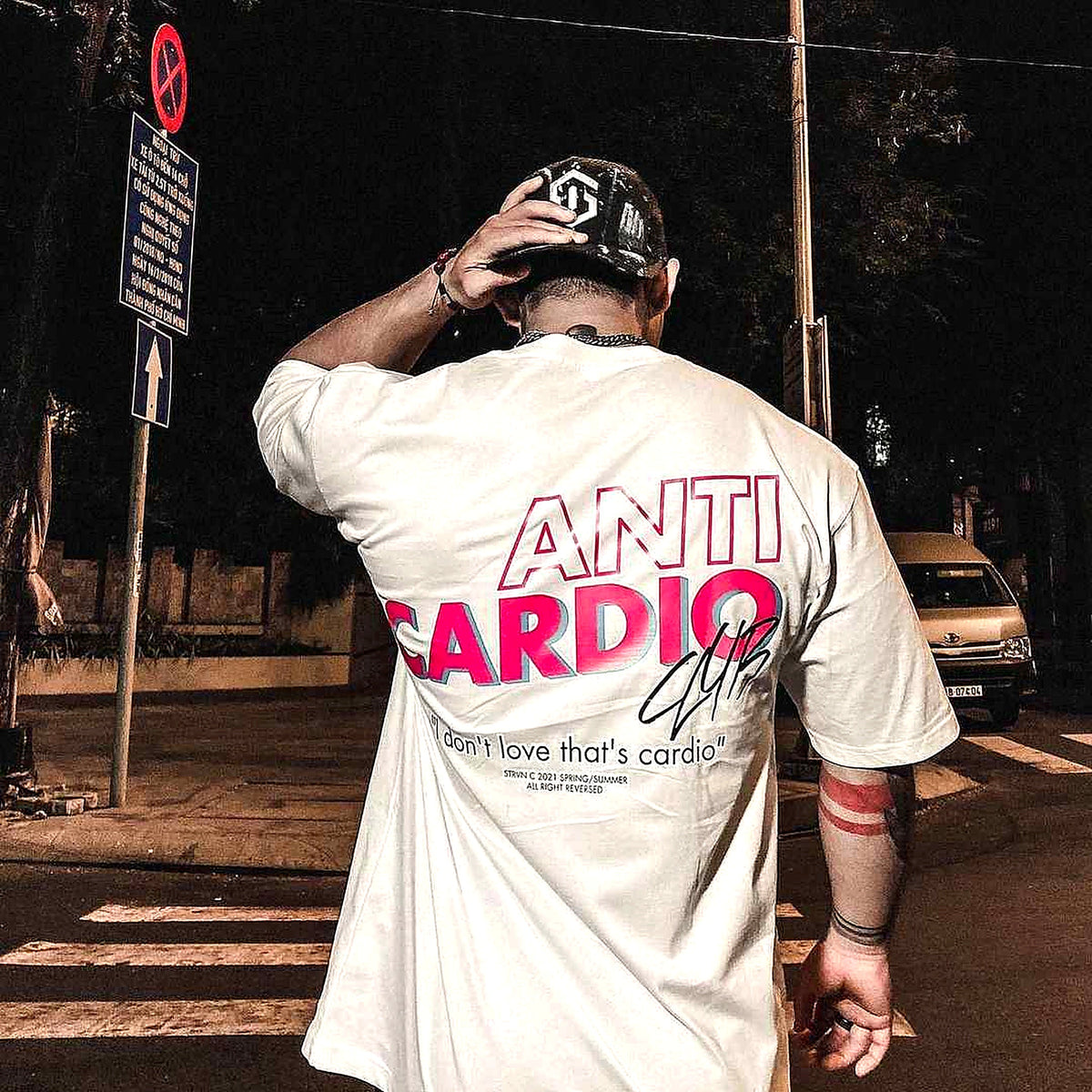 White Anti Cardio shirt photographed from behind with original back print